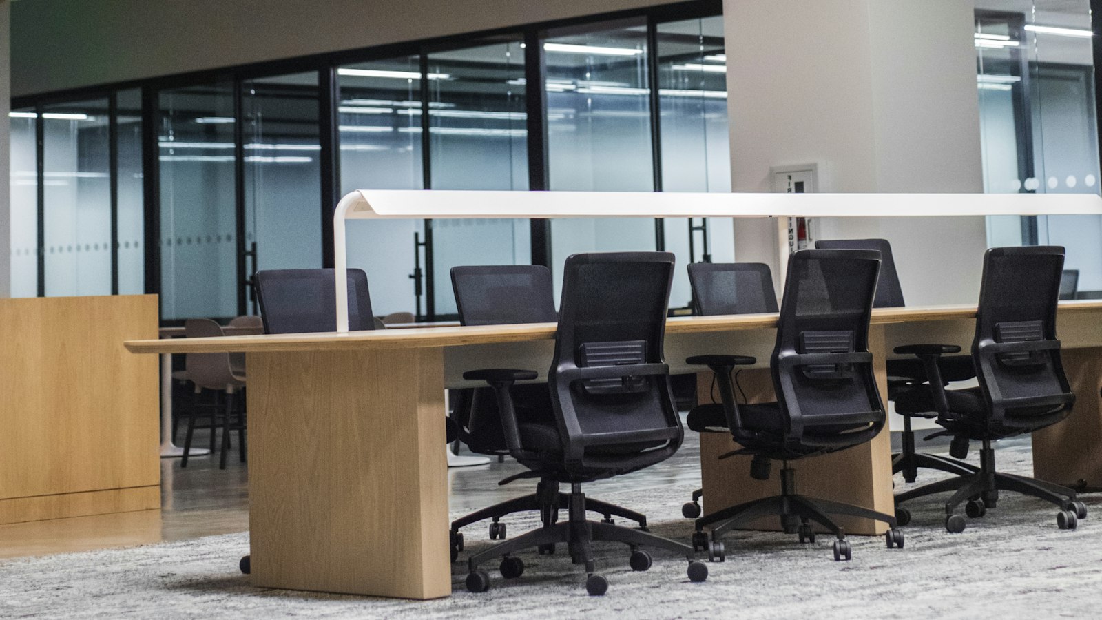 Ergonomic office chairs around a shared work table