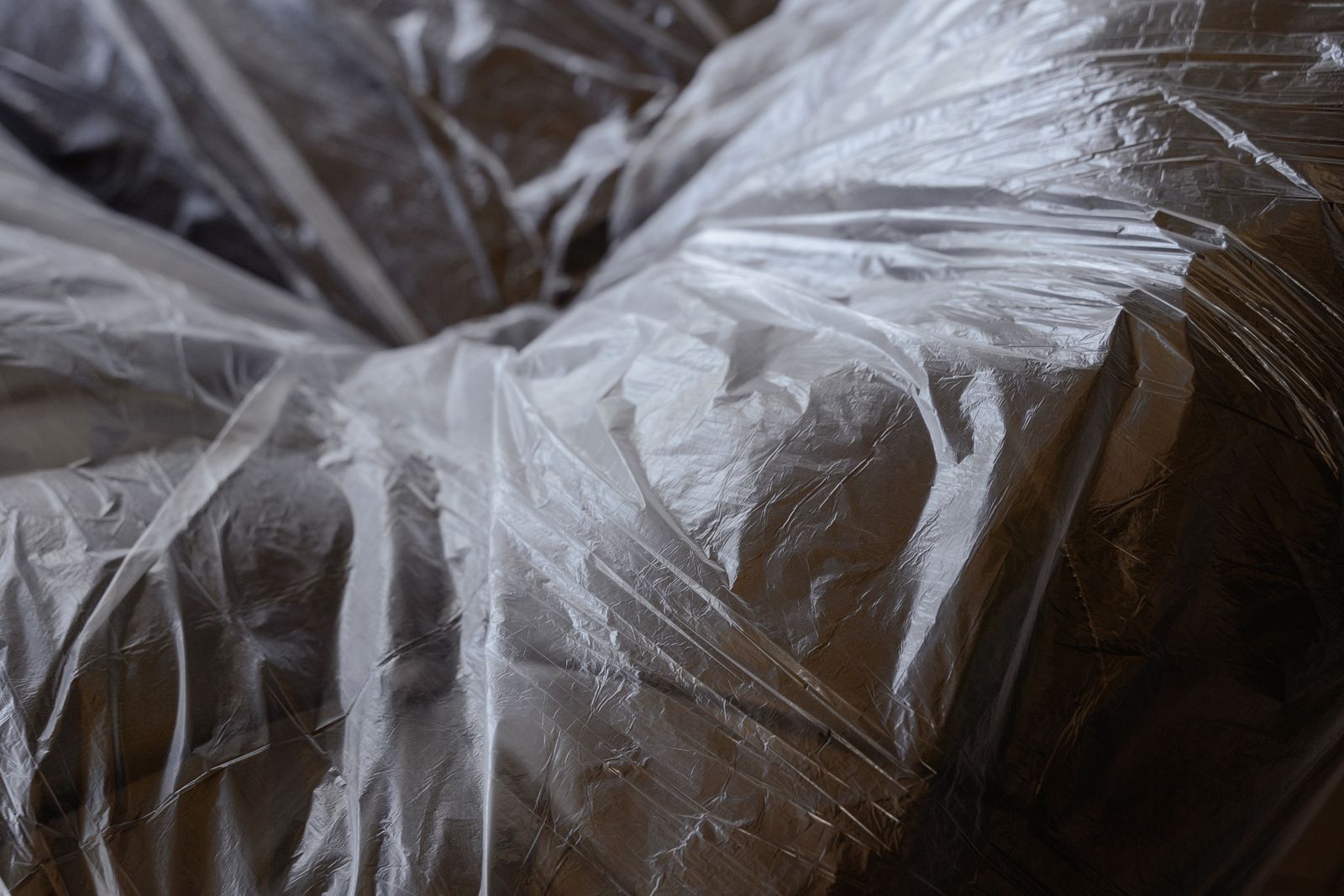 Furniture wrapped in protective film for shipping