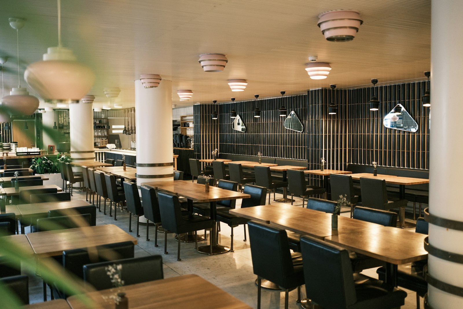 Restaurant dining room with wooden tables and upholstered chairs