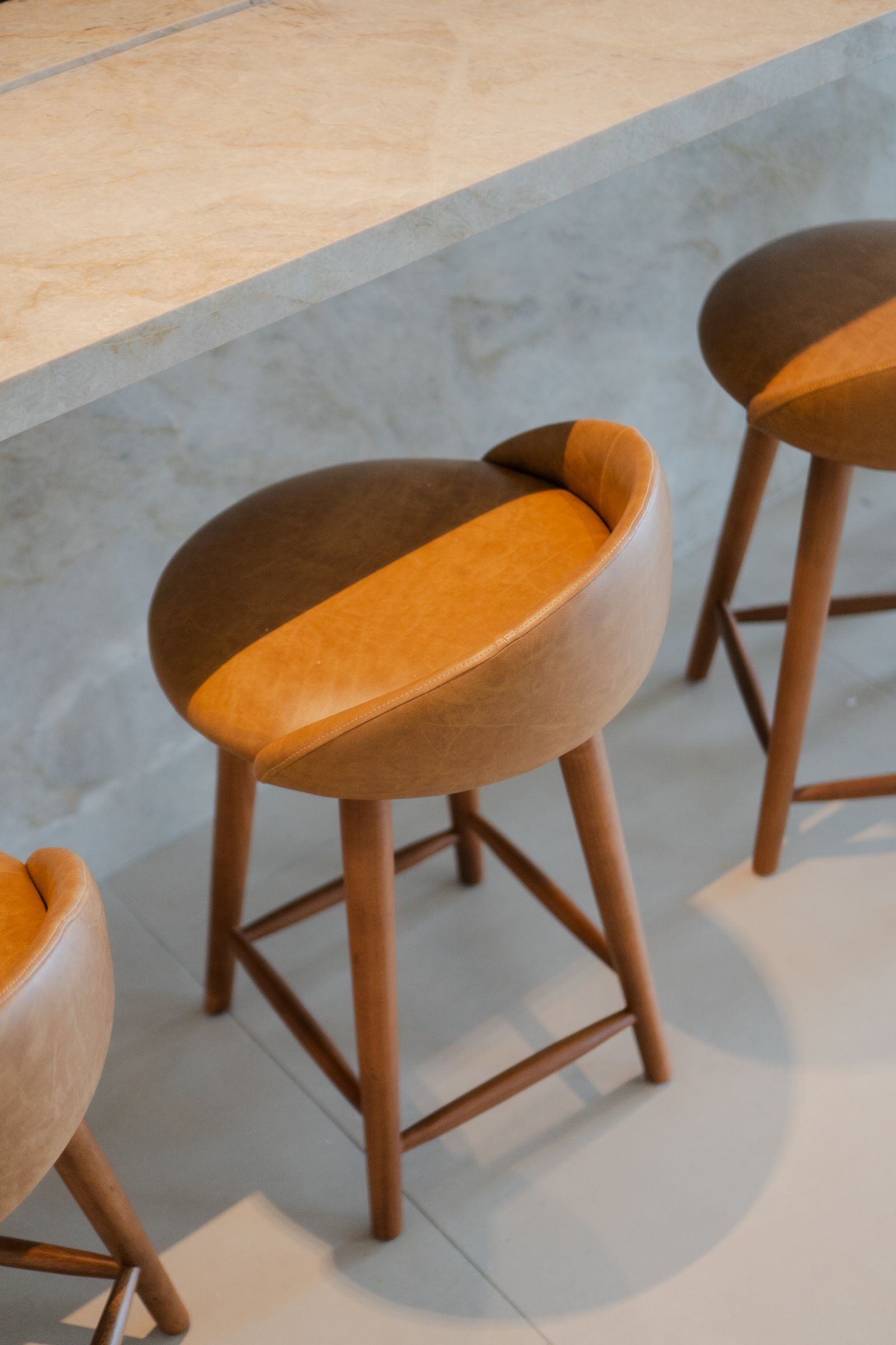 Wooden bar stools with upholstered seats
